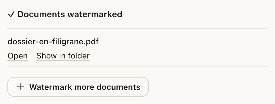 The “✓ Documents watermarked” list with the file dossier-en-filigrane.pdf, the actions “Open” and “Show in folder”, then “Watermark more documents”.